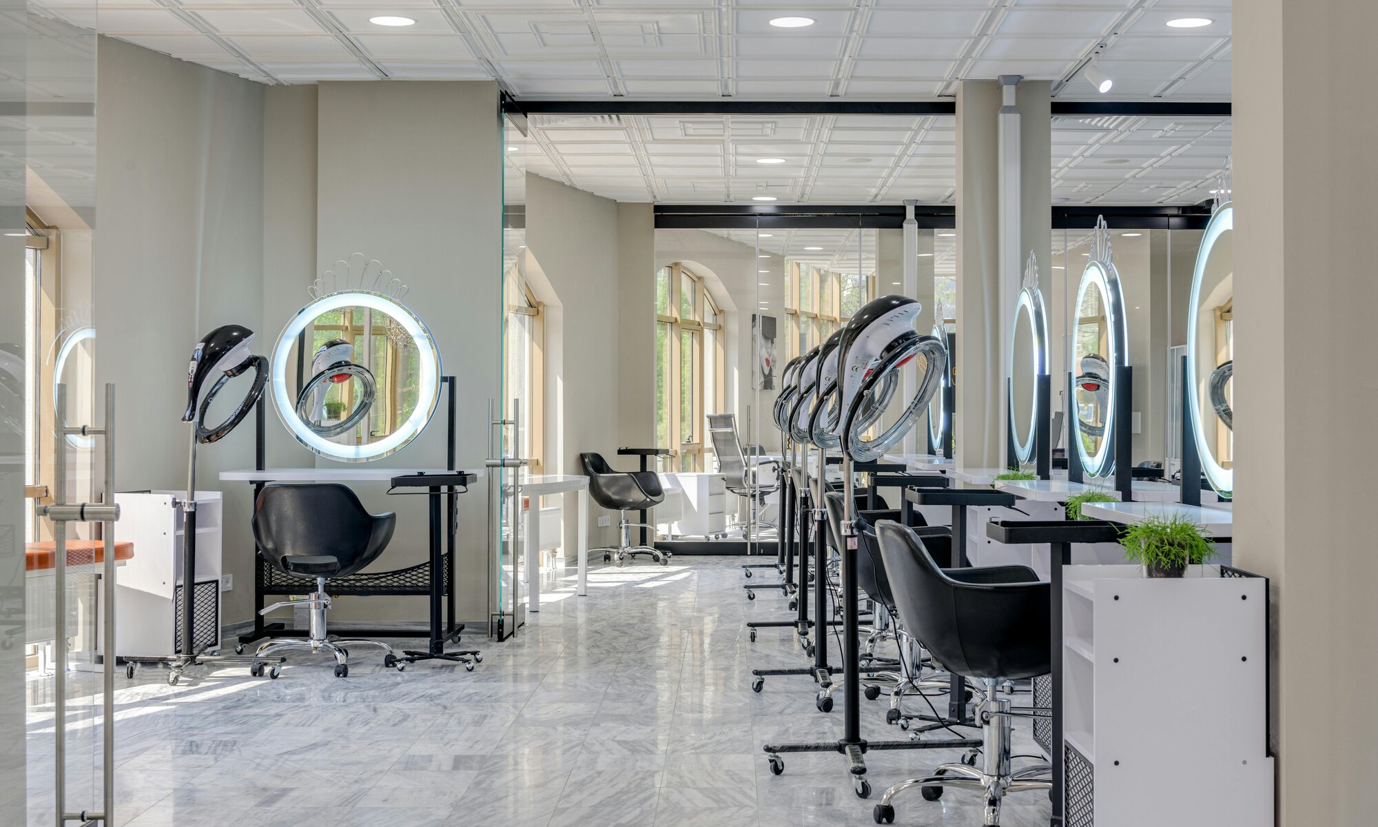 Bright modern hair salon interior with styling chairs and mirrors